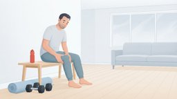 A man in his late forties sits on a birch bench in a bright living room the morning after a workout, pressing on his stiff thigh, with a pair of dumbbells and a rolled mat on the floor beside him