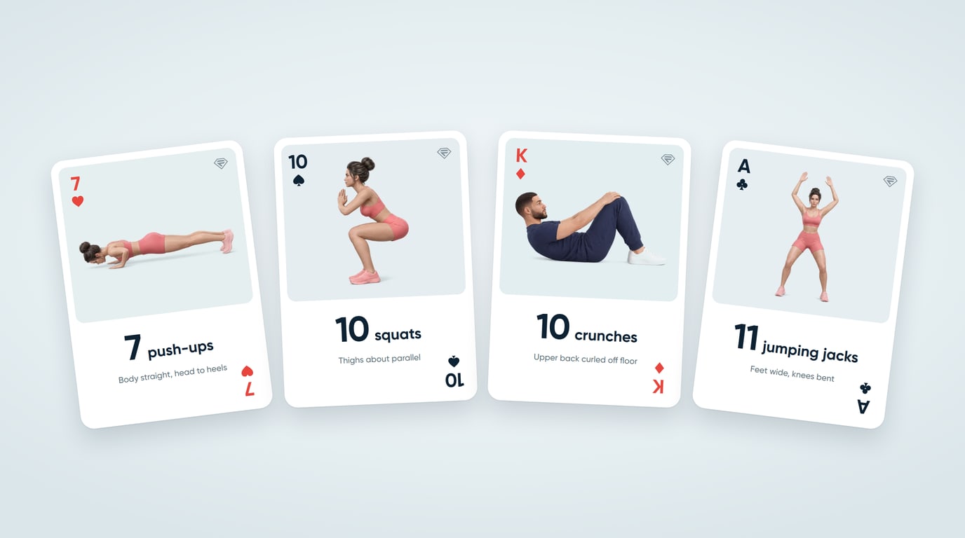 Four cards from a deck of cards workout: the 7 of hearts for 7 push-ups, the 10 of spades for 10 squats, the king of diamonds for 10 crunches and the ace of clubs for 11 jumping jacks